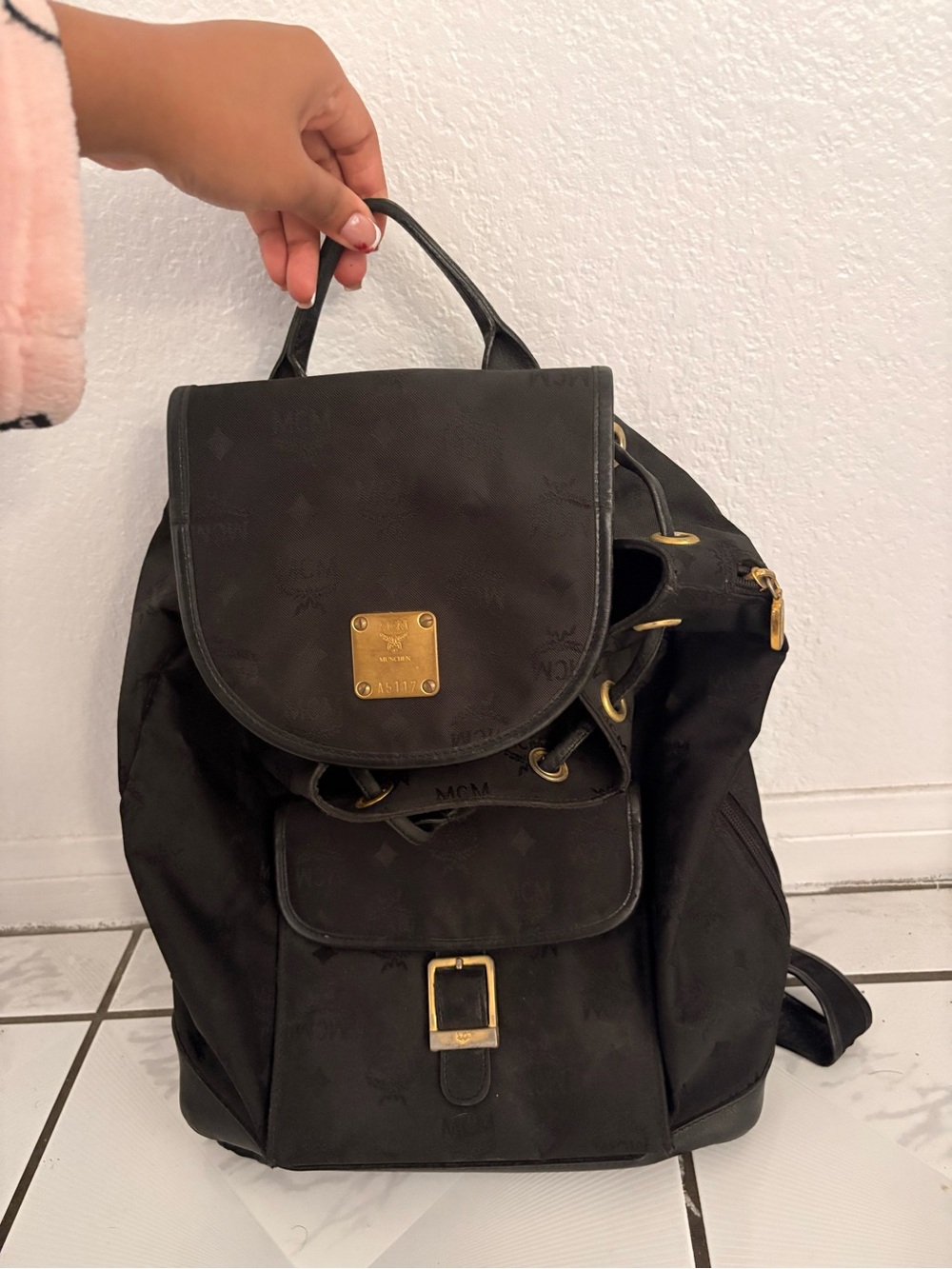 MCM Black Backpack with Gold Plaque